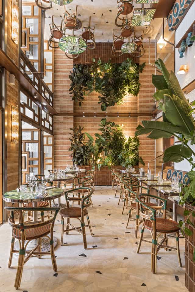 Elegant dining venue with lush greenery for intimate gatherings and corporate events.
