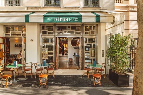 Charming café entrance at Le Petit Victor Hugo, perfect for networking events and gatherings.