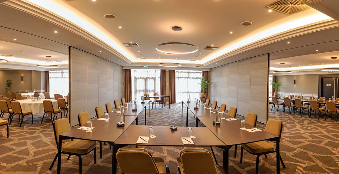 Ealing Suite meeting room with U-shaped seating for professional events at DoubleTree Hilton.