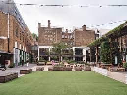 Eccleston Yards outdoor venue with green space, ideal for events and gatherings.