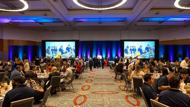 Ballroom 6AB banquet setup with guests networking at San Diego Convention Center event.