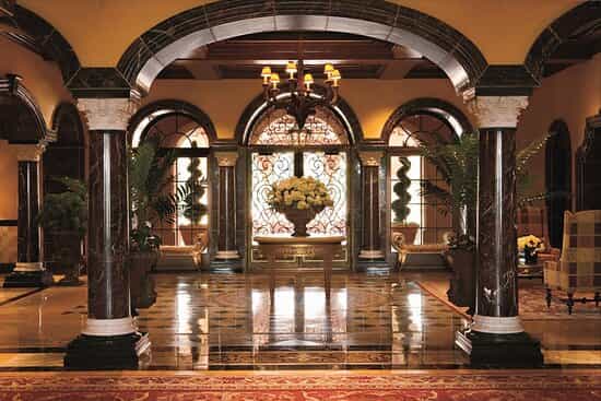 Elegant Elizabeth Ballroom lobby with ornate columns, perfect for receptions and meetings.