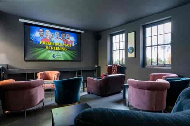 Cozy Screening Lounge in Zebrano Soho for Premier League sports events with plush seating.