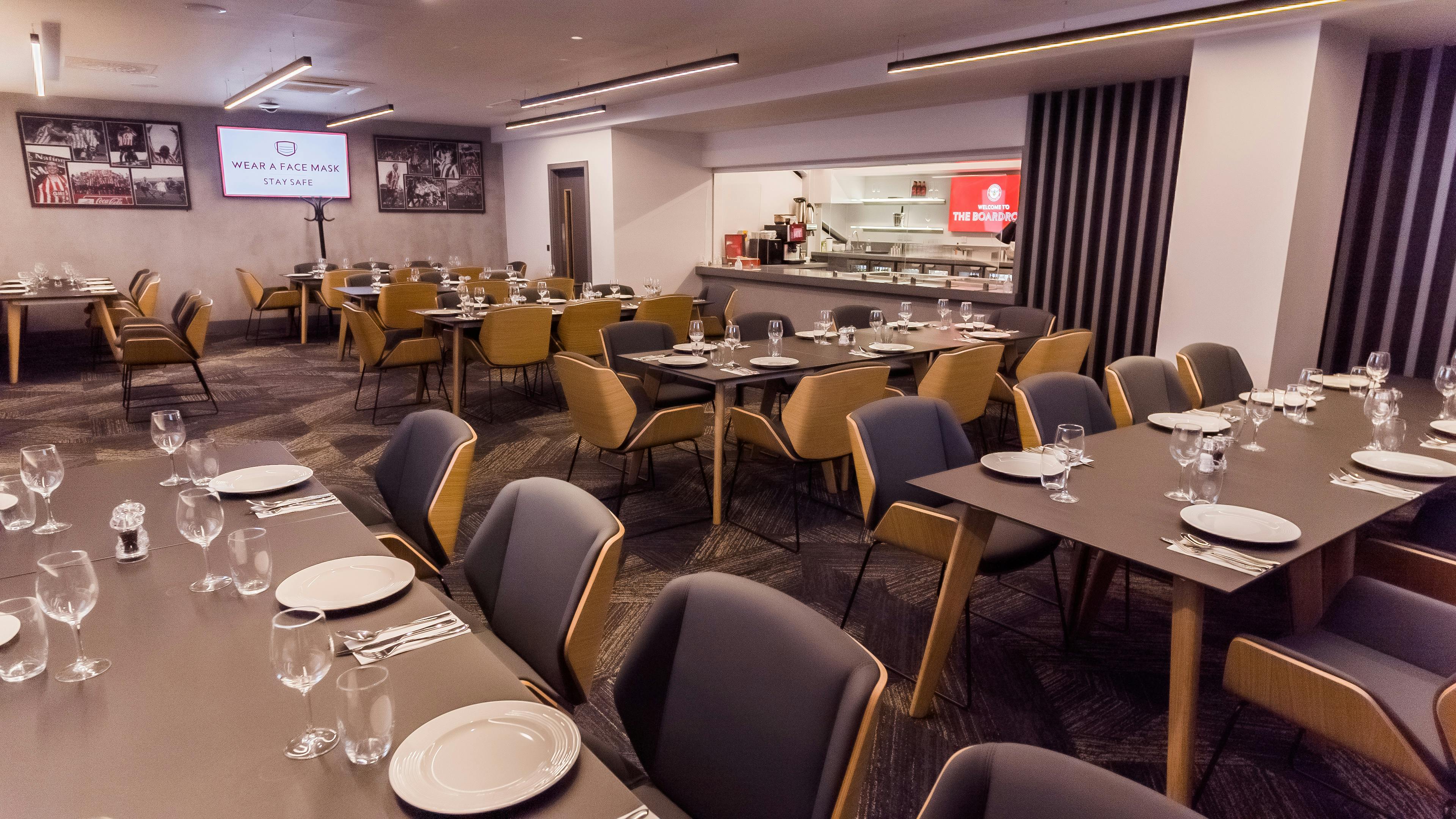 The Boardroom at Brentford FC: elegant dining space for corporate events and meetings.