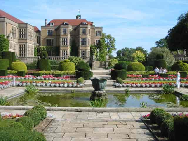 Fanhams Hall garden venue with manicured hedges, ideal for weddings and events.
