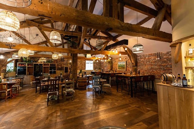 Luxury wedding venue with rustic beams and warm lighting, ideal for intimate gatherings.