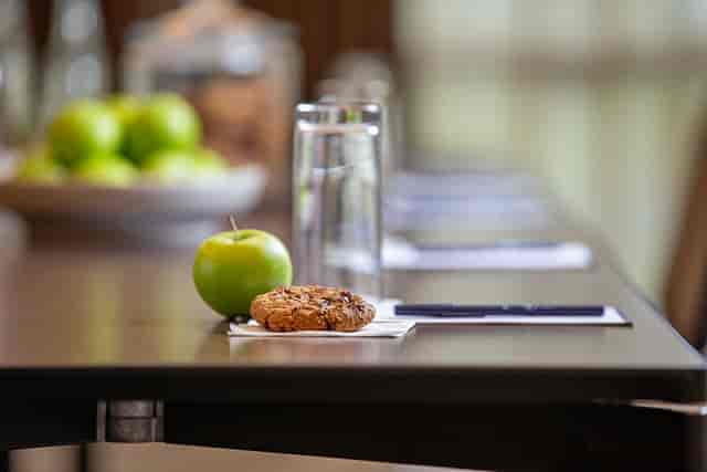 Byron Suite meeting setup with organized table, refreshments for corporate events.