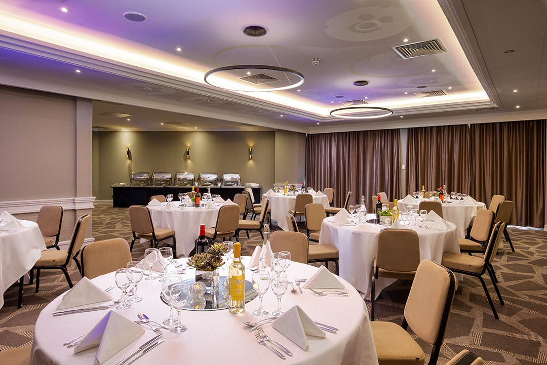 Byron Suite at DoubleTree London Ealing, elegant dinner setup for corporate events.