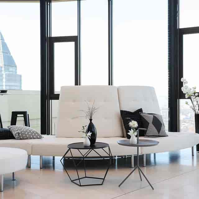 Modern lounge area with sleek white seating, ideal for networking events and meetings.