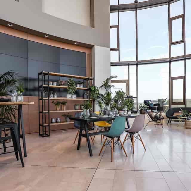 Modern event space with natural light, perfect for networking and small meetings.
