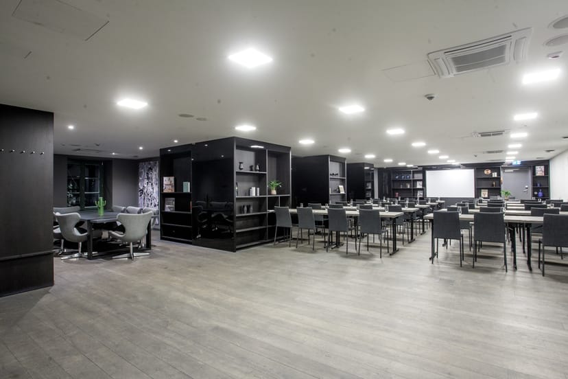 Versatile meeting space in Pullman Riga with modern decor for corporate events.