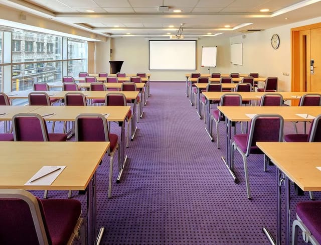 Lambda meeting room at Radisson Blu, ideal for workshops with natural light and AV setup.