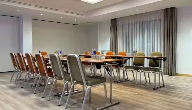 Meeting room at Radisson Blu Elizabete, Riga with long table and natural light.