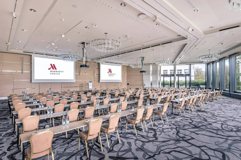 Conference room at Zurich Marriott Hotel with dual screens for corporate events.