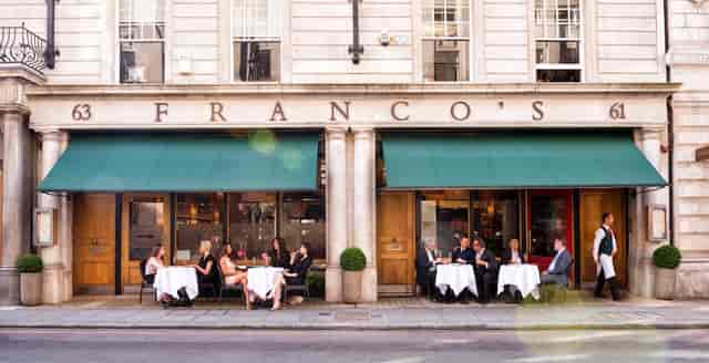 Private dining room at Franco's with elegant tables, perfect for upscale events.