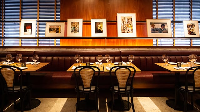 Private dining room at Smyths Tavern with elegant table settings for corporate events.