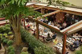 Private dining room at Mediterra Restaurant, vibrant outdoor space for events and gatherings.
