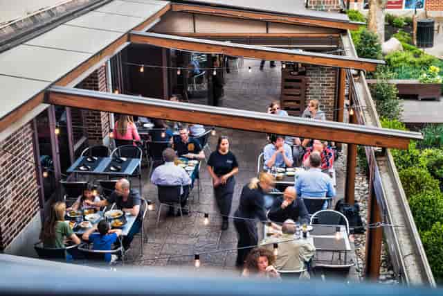 Private dining room at Mediterra Restaurant, ideal for events with vibrant outdoor seating.