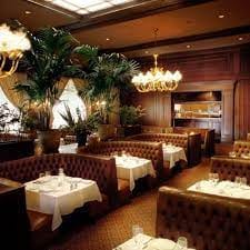Tufted leather booths in JC Bruno Library room for upscale private dinners and networking events.
