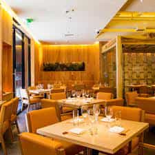 Private dining room at Roka Akor with elegant table settings for intimate gatherings.