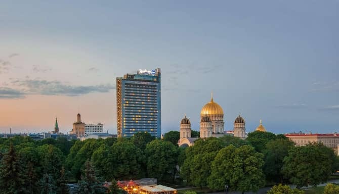 Lambda at Radisson Blu Latvija: modern hotel, historic skyline, ideal for events.