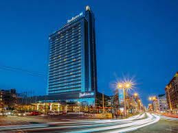 Radisson Blu Latvija at dusk, ideal venue for conferences and events.