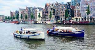 Private boats in scenic canal for waterfront events and team-building activities.