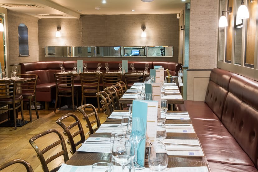Private dining room at Cote Brasserie, elegant setting for corporate events and gatherings.