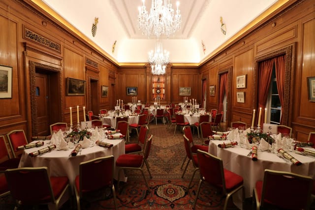 Elegant banquet room with round tables, ideal for corporate events and celebrations.