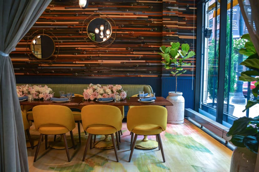 Stylish Belt Room dining space with warm wood accents for intimate gatherings and meetings.