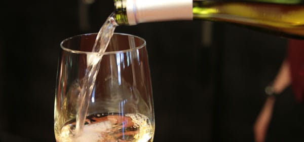 Wine being poured in a Blue Ridge Grill cellar, enhancing event beverage service experience.