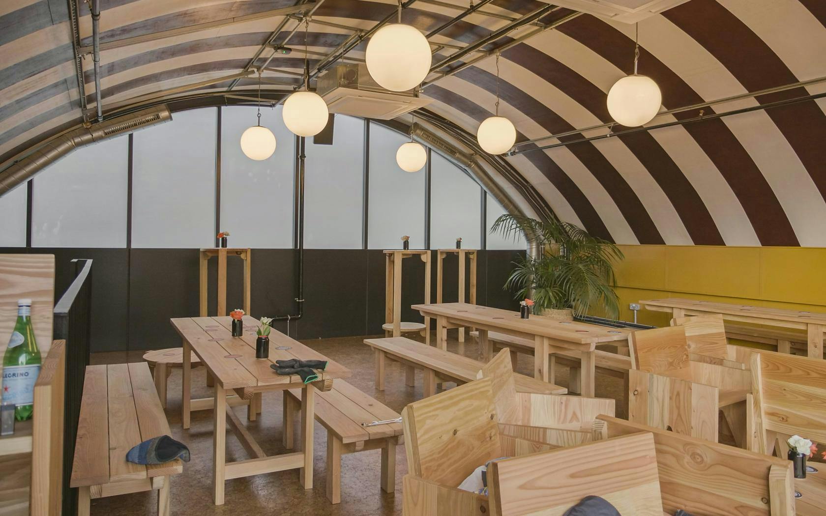 Upper Level event space at Locks Industrial Brewery with arched ceiling and natural light.