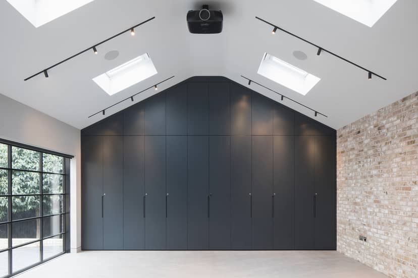 Modern event space with high ceilings, ideal for workshops and presentations.