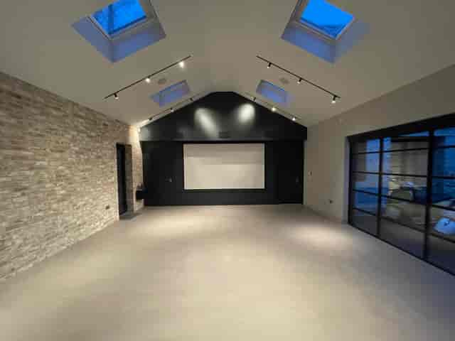 Modern event space with high ceilings, ideal for corporate meetings and social gatherings.