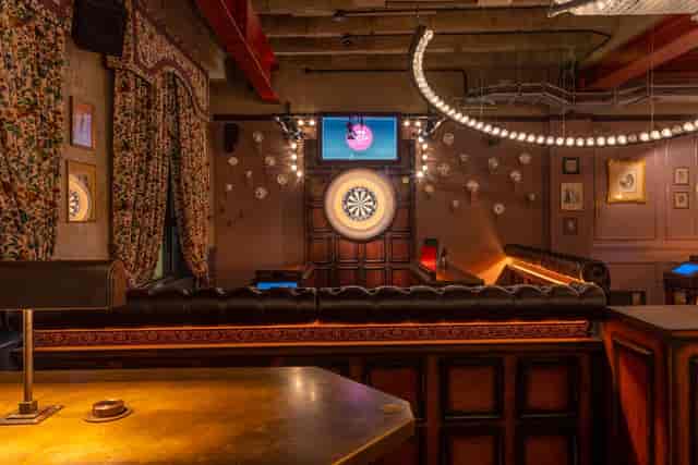 Stylish event space at Flight Club Cardiff with dartboard, perfect for team-building and mixers.