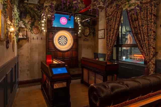 Stylish event space at Flight Club Cardiff with dartboard, ideal for networking and team-building.