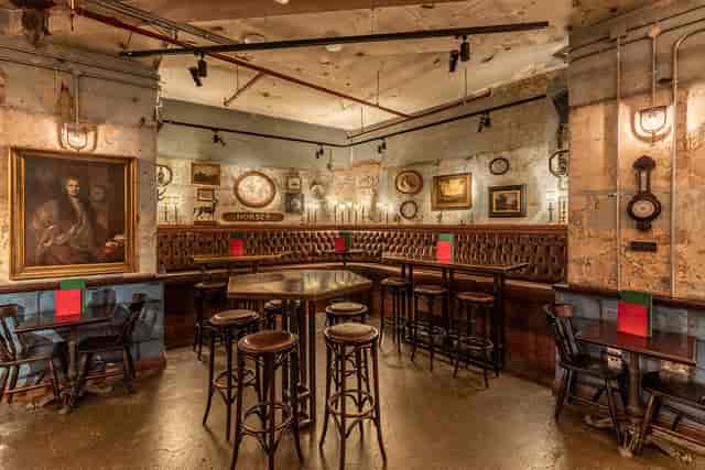 Vintage venue with warm lighting, ideal for intimate gatherings and networking events.