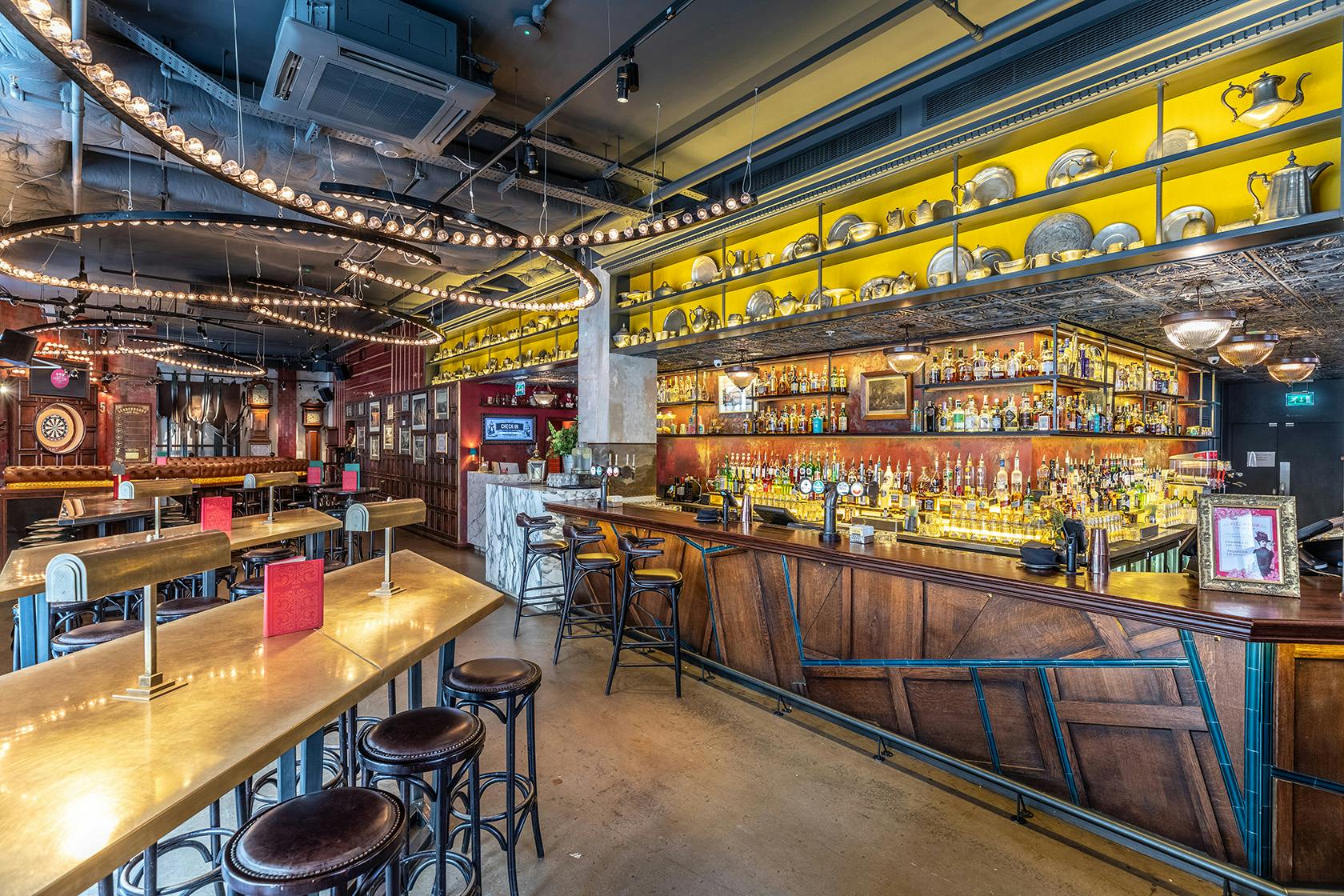 Vibrant bar setting at Flight Club Shoreditch for networking events and meetings.