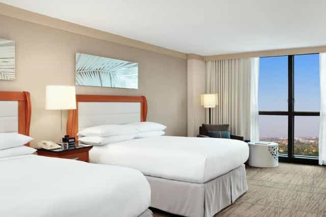 "DoubleTree Miami hotel room with two queen beds, perfect for conferences and events."
