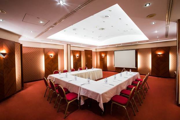 Meeting room at Rahat Palace Hotel, Almaty - U-shaped setup for conferences and workshops.
