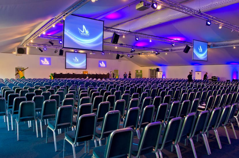 Corporate event venue in Thorpe Park with rows of chairs for conferences and presentations.
