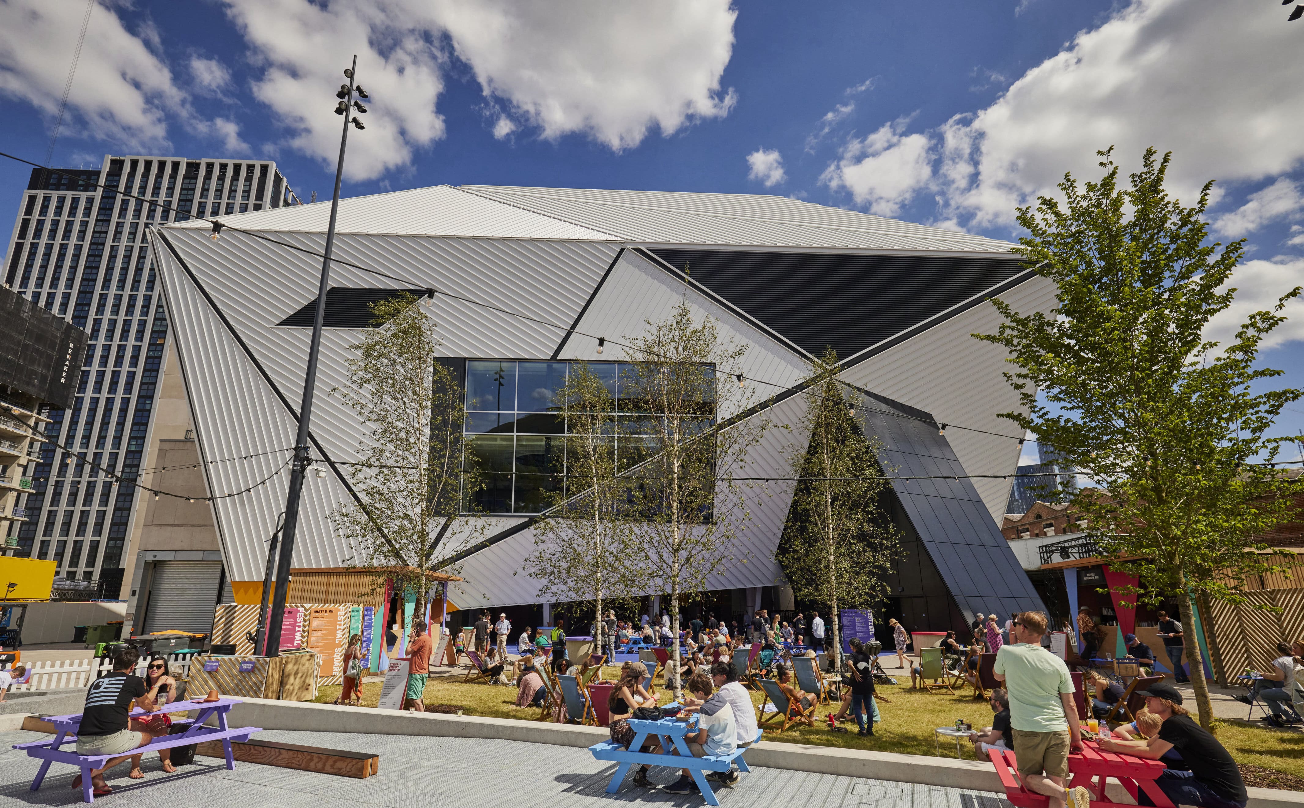 Modern Aviva Studios venue with vibrant outdoor space for events and gatherings. - Banner