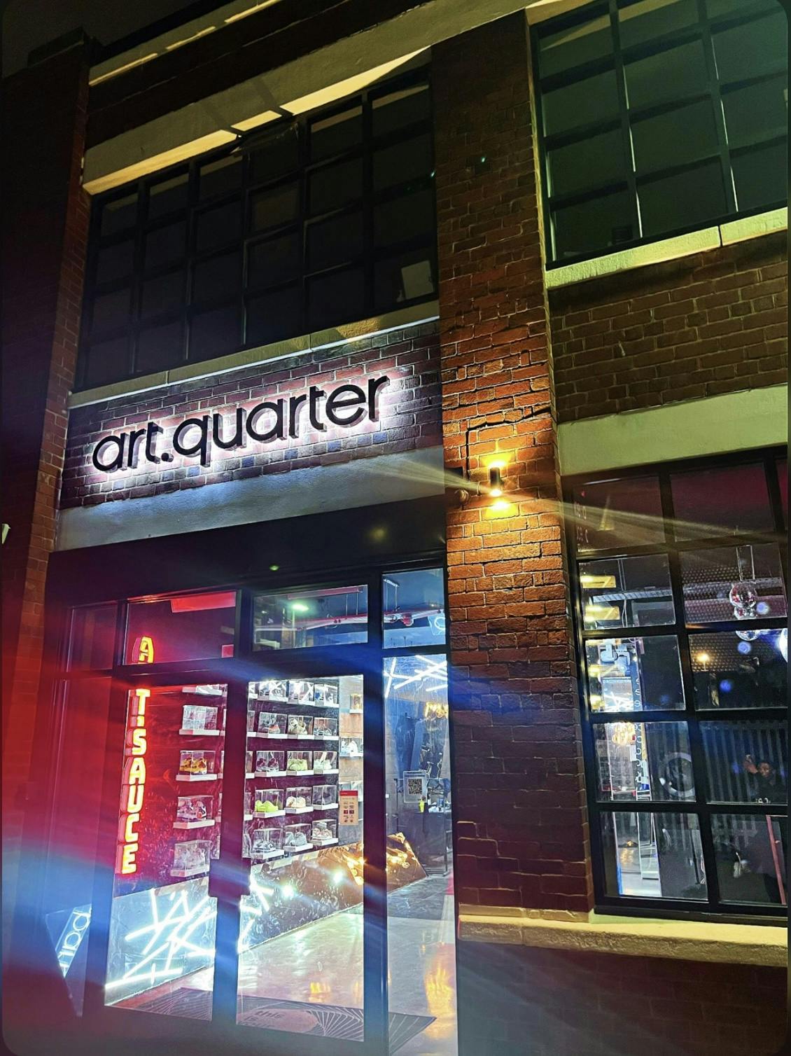 Modern art venue "art.quarter" with illuminated signage, perfect for exhibitions and events.