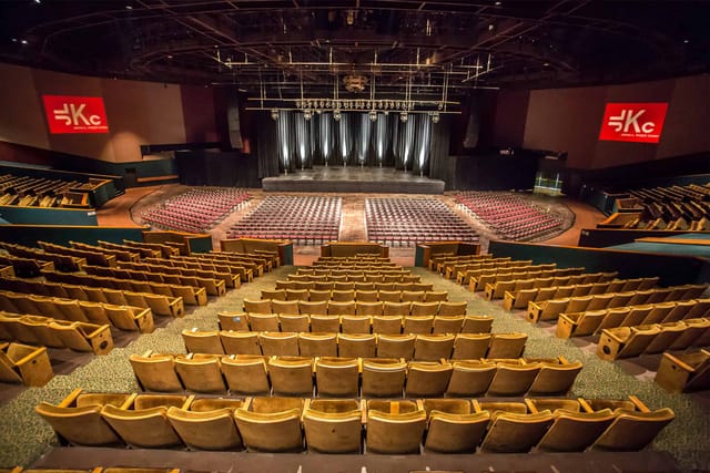 Ashe Auditorium stage with tiered seating for conferences and concerts.