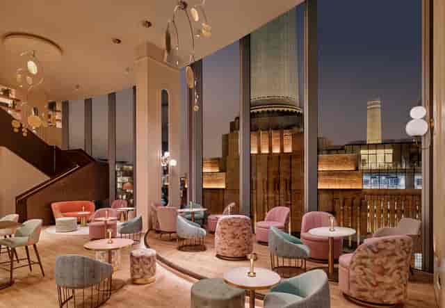 Stylish Joia Bar event space with elegant seating and city views, perfect for gatherings.