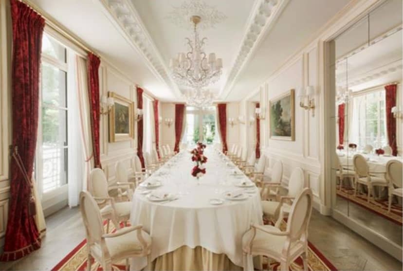 Elegant banquet room at Ritz Paris, featuring a long table for corporate events.