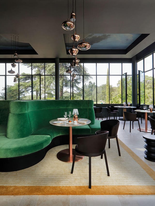Modern LA VERRIÈRE restaurant with green seating, ideal for upscale events and private dining.