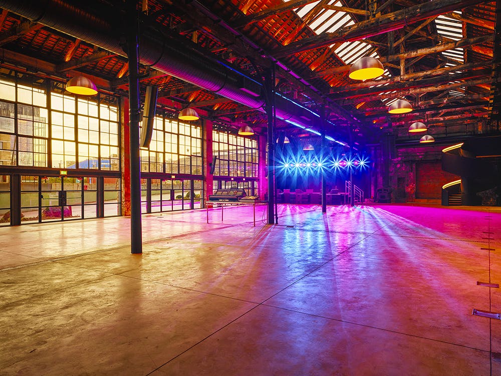 Spacious Boiler Shop event venue with high ceilings, perfect for gatherings and receptions.