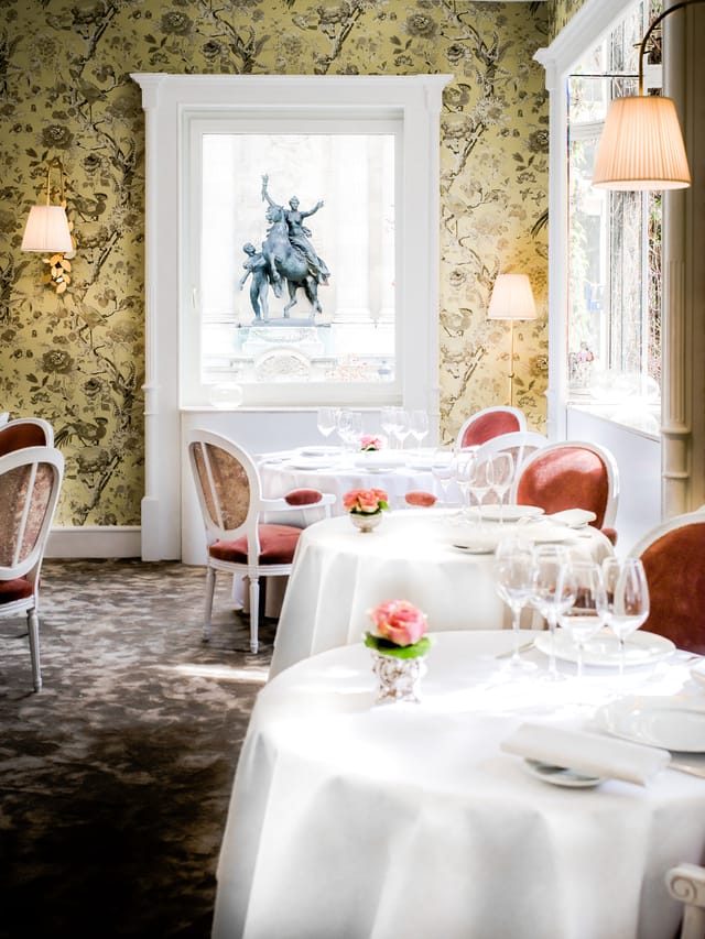 Elegant dining space at Restaurant Lasserre, ideal for upscale events and gatherings.