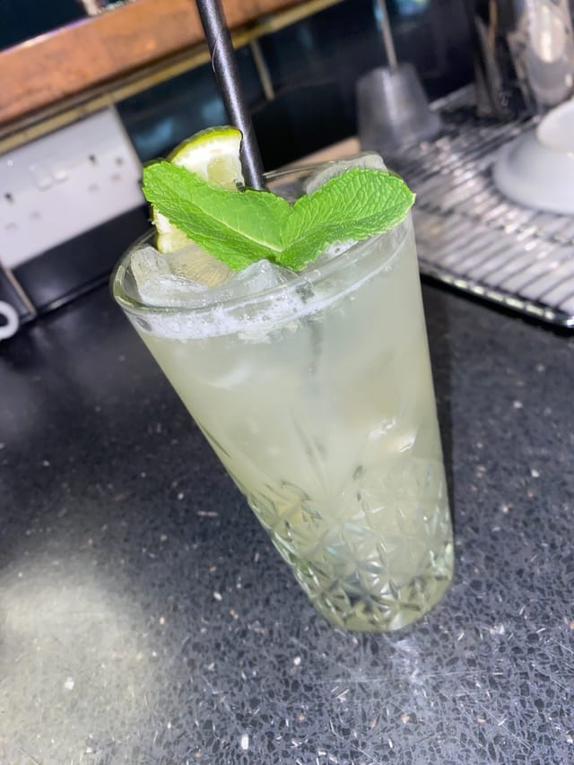 Refreshing cocktail with mint and lime at Alfie’s lounge summer event.